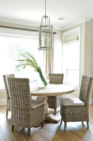 Round Salvaged Wood Dining Table With Wicker Dining Chairs Transitional Dining Room Wicker Dining Chairs Transitional Dining Room Dining Chair Design
