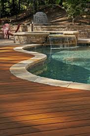Inground pool decking options are more versatile and can be constructed using wood, concrete, tile or other patio flooring materials. 8 Wood Pool Deck Ideas Wood Pool Deck Pool Patio Pool Landscaping