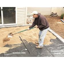 Use a stiff brush to scrub the entire surface down. How To Cover A Concrete Patio With Pavers Diy Family Handyman