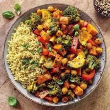 Curried Brown Rice With Curried Vegetables Sweet Potato Carrot Courgette Broccoli Florets Red Bell Pepper And Chickpeas Sprinkled With Sesame Dried And F