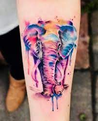 Watercolor Elephant Tattoo On Arm Watercolor Elephant Tattoos Colorful Elephant Tattoo Elephant Tattoo Design