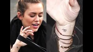 'anchor' tattoo near her right wrist. Miley Cyrus New Tattoos Miley Cyrus New Tattoo Has A Misspelled Message Youtube