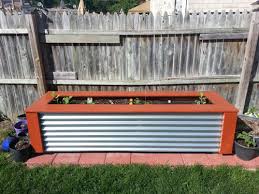 Diy Corrugated Metal Garden Planter This Abandoned House Wood Planters Garden Planter Boxes Garden Planters