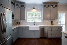Standard upper cabinets with doors offer plenty of storage with a clean and composed look. Farmhouse Kitchen Farmhouse Sink Grey Shaker Cabinets Small Glass Upper Cabinets On Top Of Upper Cabinets Marbl Glass Upper Cabinets Home Additions Kitchen