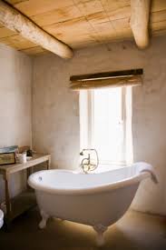 To apply paint to your bathtub with a brush, apply a thin coat, starting in one corner of the tub and working your way across with an even stroke. How To Repaint A Bath With Enamel Paint Homesteady