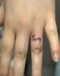 Search only for generate name tattos on ring finger Name Tattoo Ideas Wedding Finger Ring Finger Tattoos Name Tattoo On Finger Small Finger Tattoos
