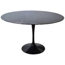 The lowell dining table by interlude features a sculptural steel base with an antique bronze finish that supports a beautiful and opulent carrara white marble top. Carrera Marble Dining Table 10 For Sale On 1stdibs