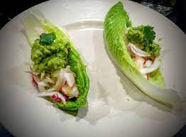 Divide the lettuce among four bowls and top each with a fish fillet, some mango, and some slaw. Fish Taco Lettuce Wraps With Lime Infused Cabbage Radish Slaw Paleo Gluten Free Pescatarian Mypaleos