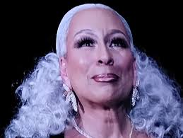 Moira: "Who do I look like?" Johnny: "I wanna say Tonya Harding."