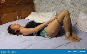Beautiful Woman Lying in Bed in Pantyhose and Mini Skirt Stock Photo -  Image of portrait, white: 225346420