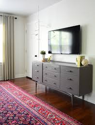 Hollow or flexible plinths are ideal for hiding cables, and are fitted onto a carrier strip mounted on the wall. Clear The Clutter How To Hide Tv Wires And Cords Guest Post From Young House Love Roku