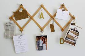 11 Creative Ways To Use An Accordion Peg Rack Hgtv Accordion Peg Rack Peg Rack Hanger Decor