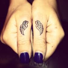 A tribal finger tattoo represents various things such as, the delicately designed eye in the tattoo depicts awareness, and the moon symbolizes femininity and womanhood. Cute Fingers Tattoo Design