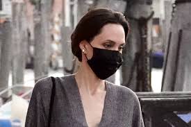 A community for 9 years. Angelina Jolie Is Elegant In Italy In Gray Caftan Sharp Brown Mules Footwear News