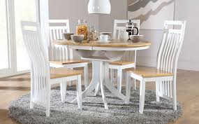 Toss a few shimmering snowflakes on your table for a wintry look, add jewel encrusted napkin rings for a dose of dazzle, or round out the look with a handsome candleholder set. Small Round Dining Table And Chairs Hudson White Lyla Stores