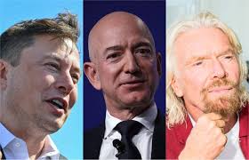 Jeff bezos, second from left, with crew mates, from left, oliver damen, 18, wally funk, 82, and mark bezos at the landing pad after they flew on blue origin's inaugural flight to the edge of space. How Jeff Bezos Space Company Compares To Musk S And Branson S