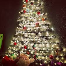 Diy Christmas Trees Perfect For Small Spaces Wall Christmas Tree Hanging Christmas Lights Diy Christmas Tree