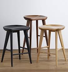 The tractor seat of the stool is made out of dark oak wood with its legs being carved out of light pine wood. Wooden Tractor Seat Bar Stools You Ll Love In 2021 Visualhunt