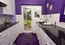 Here's proof that this bold hue can work for your cooking space. Fifty Shades Of Purple The White Kitchen Unit Is Offset By The Purple Walls And Carpet Purple Kitchen Purple Home European Home Decor