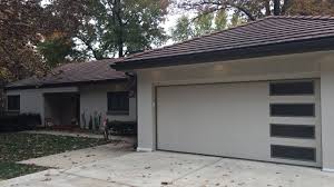 Sizes and shapes are consistent and repeated in windows and doors. Traditional Contemporary Garage Door Designs