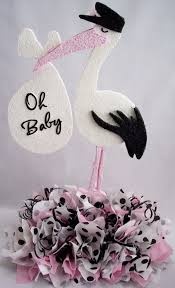 41 Easy To Make Baby Shower Centerpieces Snugglejug Baby Shower Centerpieces Stork Baby Showers Baby Shower Yellow