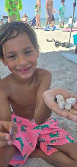 I've been celebrating Shark Week since its inception. It's BIG in our  family. We watch the episodes, play games, bake things, carve other things.  I think this photo of my daughter and