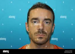 Police say Brent Troy Bartel, pictured, used a box cutter to carve a  pentagram into the back of his young son Wednesday, December 12, 2012, then  dialed 911 and told a dispatcher, "