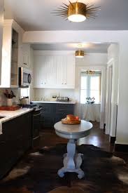 Find inspiration for finding the perfect countertop to pair with your dark cabinetry within this article's photos and helpful design advice! White Upper Cabinets Dark Lower Cabinets Contemporary Kitchen Sherwin Williams Magnetic Gray Nest Egg