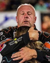 This photo simply speaks for itself. Brad Lewis embraces his daughter  Emilee Lewis after their race, just an hour after they lost Robbie Brewer.  A hug that everyone needs sometimes.