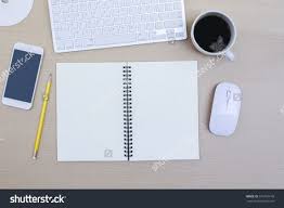 Office Desk Table With Computer Notebook Flower And Coffee Cup Top View With Copy Space