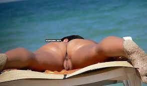 Nudist and naturist beach babes sunbathing nude and teasing strangers with