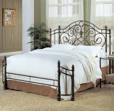 Bold metal borders the headboard, along with small, round grooved details to contrast beautifully. Bedroom Iron Headboard Bed Wrought Wood Rod Furniture Ideas Vintage Beds Metal Modern Black Headboards Antique Affordable For Queen Apppie Org