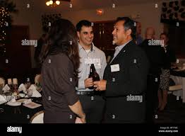 Paul Chapa (right), the founder of Food Industry Serving Heroes foundation,  speaks to Sgt. Kyle W. Hussin, a noncommissioned officer with Combat  Logistics Regiment 27, 2nd Marine Logistics Group, during a Heroes