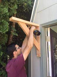 Add detail to the ground floor facade by adding the front door niche, a window, and various trim elements. How To Build A Gable Roof Over A Front Door Joyful Derivatives