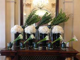 This Weeks Lobby Flower Display White Hydrangea White Calla Lilies And Green Bells Of Irela Large Flower Arrangements Hotel Flower Arrangements Hotel Flowers