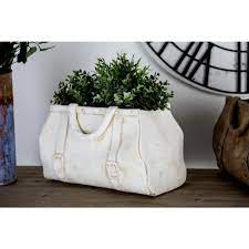 From solid black or white ceramic to natural stone, marble or glass, the ways you can utilize subway tiles in your home are only limited by your imagination. Litton Lane 10 In X 17 In White Concrete Purse Planter 38799 The Home Depot Stone Planters Flower Pots Planters