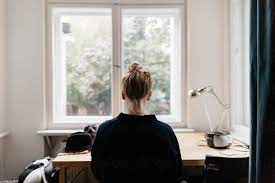 10 tips for more effective and accessible wfh communications. Woman Sitting At Desk In Front Of Window By Melanie Riccardi