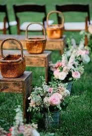 If you're in charge of planning a bridal shower, we're here to help! Wooden Bench Seating With Flowers Lining The Aisle Wedding Aisle Decorations Aisle Flowers Southern Weddings
