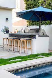 Known for its versatility, flexibility and durability ceramic tile has quickly become the ideal surface material for flooring. Outdoor Kitchen And Bar With Blue Spanish Tiles Transitional Deck Patio