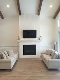 White Living Room With Shiplap Ceiling Woods Beams And Vertical Strip And Brick Fireplace By Zolmerdesign Co Home Fireplace Farmhouse Fireplace Decor Home