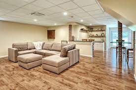 We are planning to lay laminate flooring in our basement and are wondering is there is anything we could lay down first for some warm< or should we put anything down? 75 Beautiful Laminate Floor Basement Pictures Ideas May 2021 Houzz