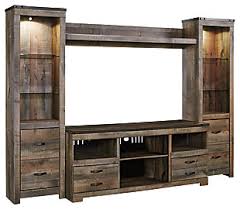 The starmore modern rustic/industrial xl tv stand, made by signature design by ashley, is brought to you by corner furniture. Entertainment Centers Ashley Furniture Homestore