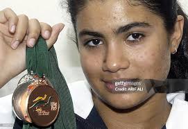 Thirteen-year-old Pakistani swimmer Rubab Raza displays medals... News  Photo