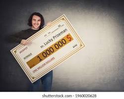 Image of person holding a giant lottery check
