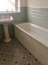 It even has a pretty liner detail in the floor. Topps Tiles Berkeley Charcoal And Diamante Mint 1930s House Art Deco Bathroom Patterned Tiles Patterned Bathroom Tiles Bathroom Flooring Bathtub Tile