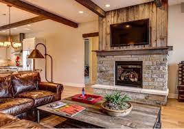Stone is the earliest and perhaps most enduring choice of material used for fireplace construction, and for good reason. Nice Fireplace Idea Stone On Bottom Half Salvage Wood Vertical Above Simple Mantel Of Same Wood And Simple Home Fireplace Fireplace Design Simple Fireplace
