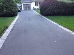 This happens on the edges of an asphalt driveway, often near the apron, or the area connecting the public street to your driveway, where the top layer is too thin. Candfield Asphalt Drive With Paving Stone Borders 2016 2 06