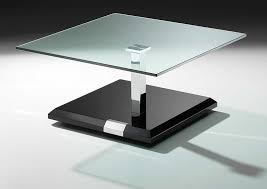 Slender bases support rounded, table tops with double rows of contrasting nail heads. Figaro