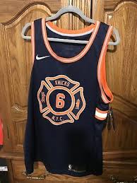 The chest features a circular logo with the phrase city never sleeps above the team name. New York Knicks City Jersey 2018