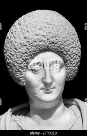 Black and white photo of sculpture of woman laying down